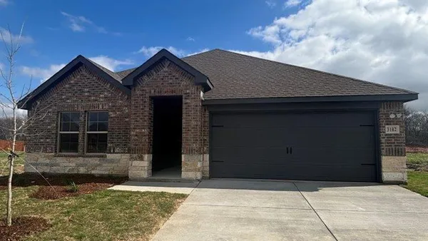 a front view of a house with yard