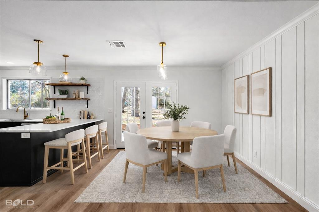 4136 Pines Road Shreveport, LA 71119 - Photo 13 of 38 Dining space featuring french doors, light wood-type flooring, and ornamental molding
