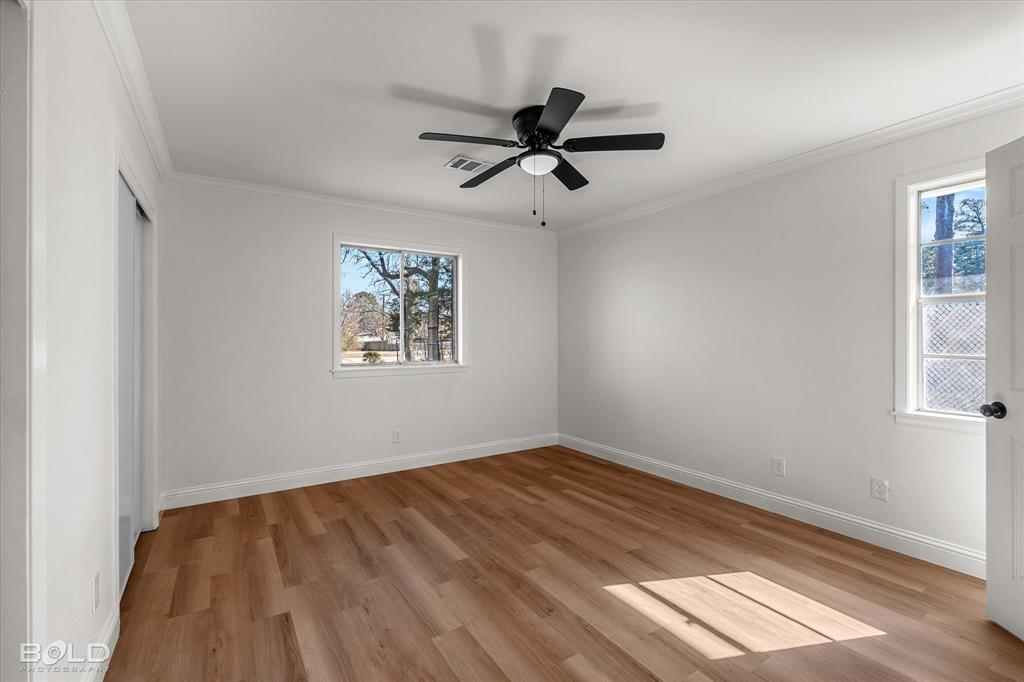 4136 Pines Road Shreveport, LA 71119 - Photo 20 of 38 Unfurnished bedroom with light wood-style flooring, a ceiling fan, and ornamental molding