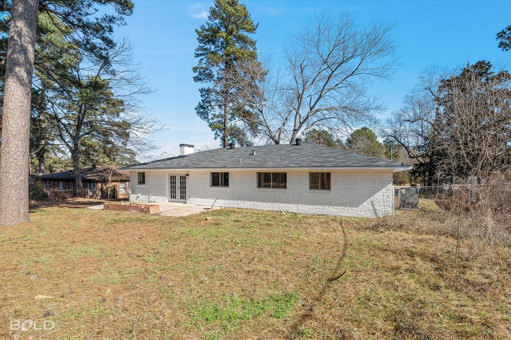 4136 Pines Road Shreveport, LA 71119 - Photo 33 of 38 Rear view of house with a patio, brick siding, french doors, and a chimney