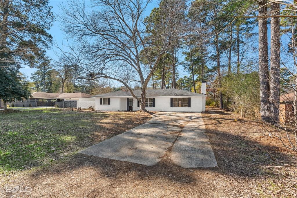 4136 Pines Road Shreveport, LA 71119 - Photo 36 of 38 Ranch-style house featuring a chimney and driveway