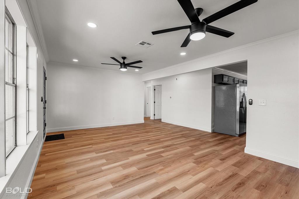 4136 Pines Road Shreveport, LA 71119 - Photo 4 of 38 Unfurnished room with ornamental molding, light wood-type flooring, recessed lighting, and a ceiling fan