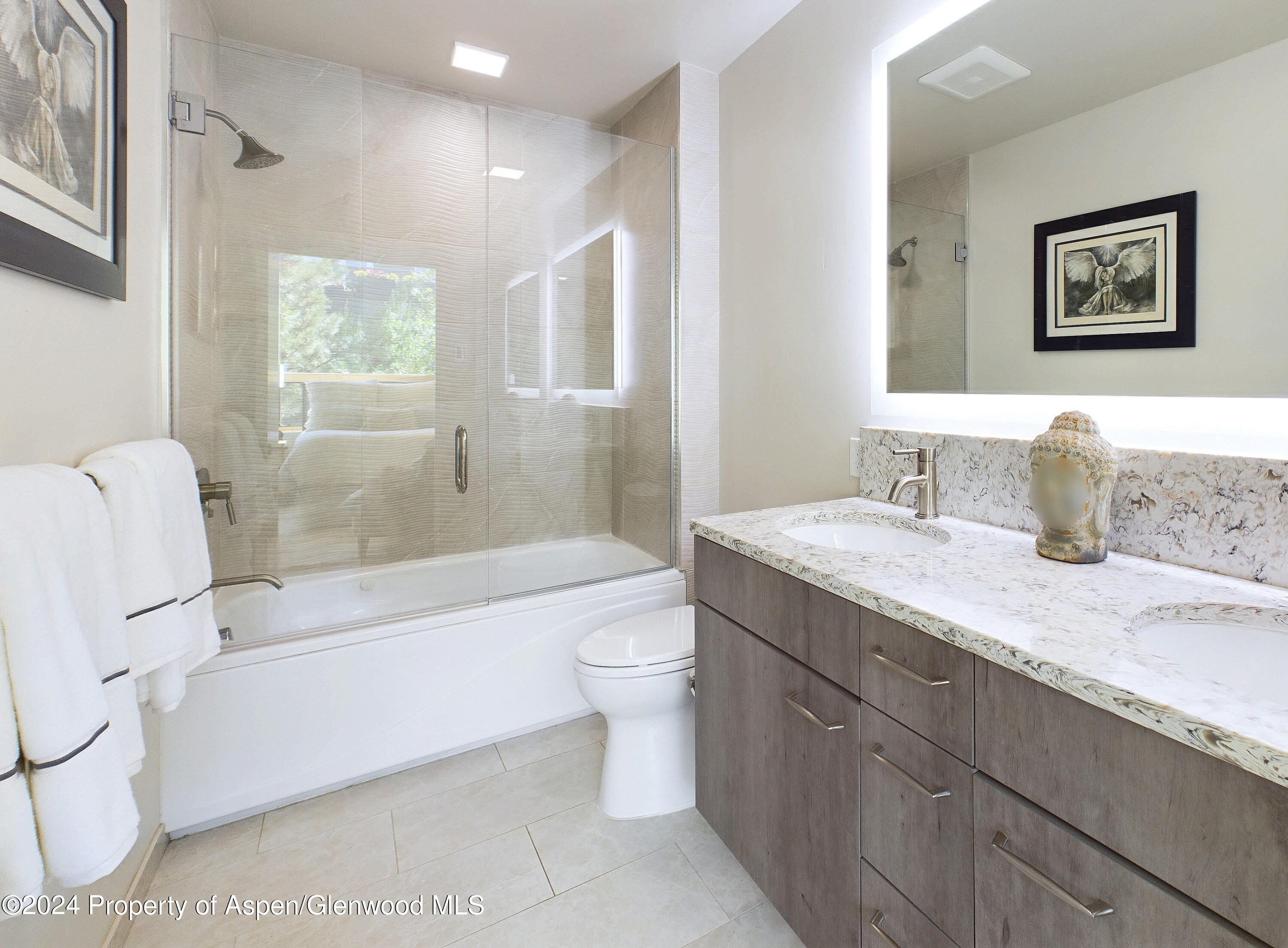 100 Evans Road, Unit 105 Basalt, CO 81621 - Photo 12 of 20 a bathroom with a granite countertop sink toilet tub and shower