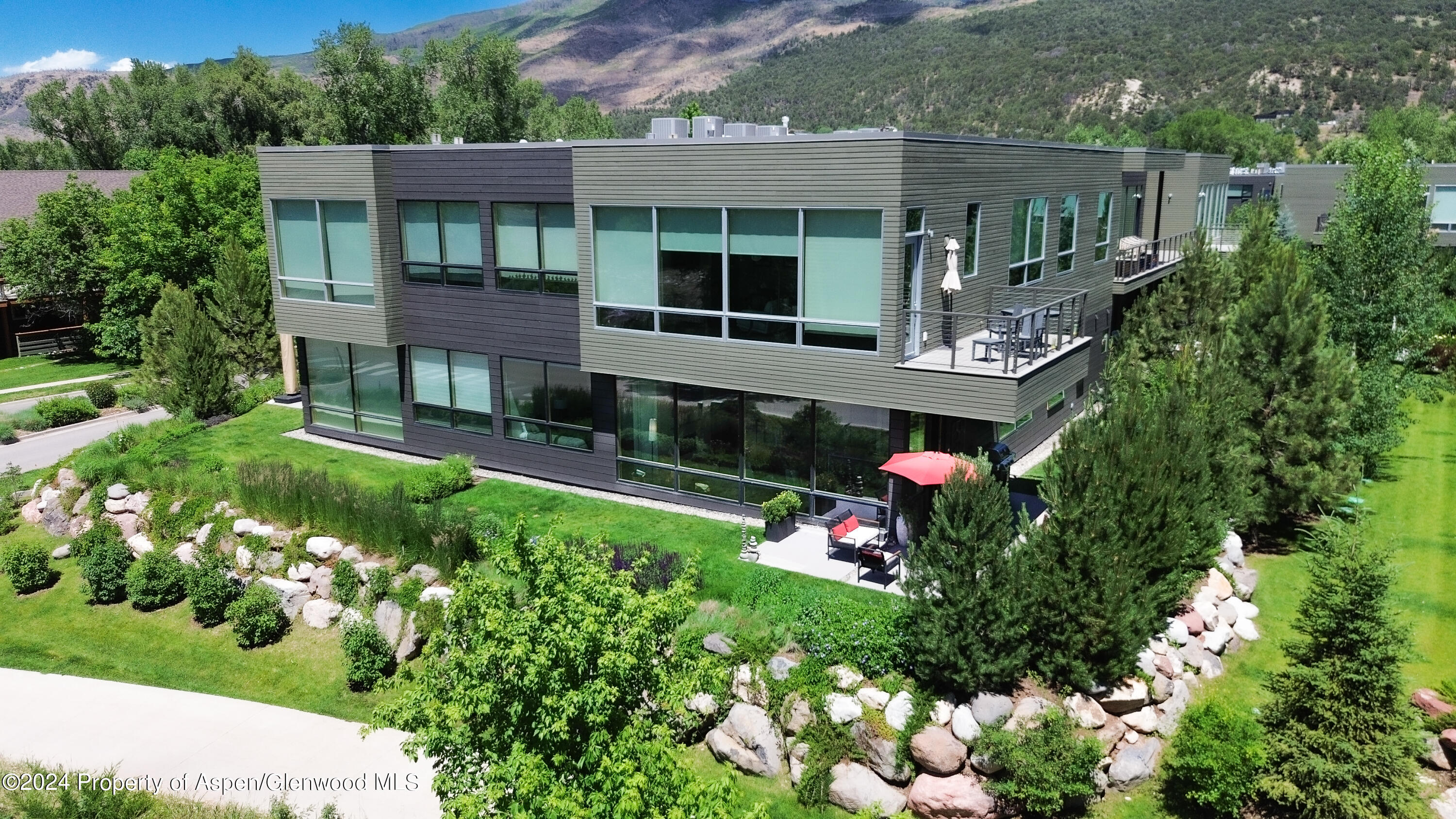 100 Evans Road, Unit 105 Basalt, CO 81621 - Photo 19 of 20 a front view of a house with a yard and potted plants