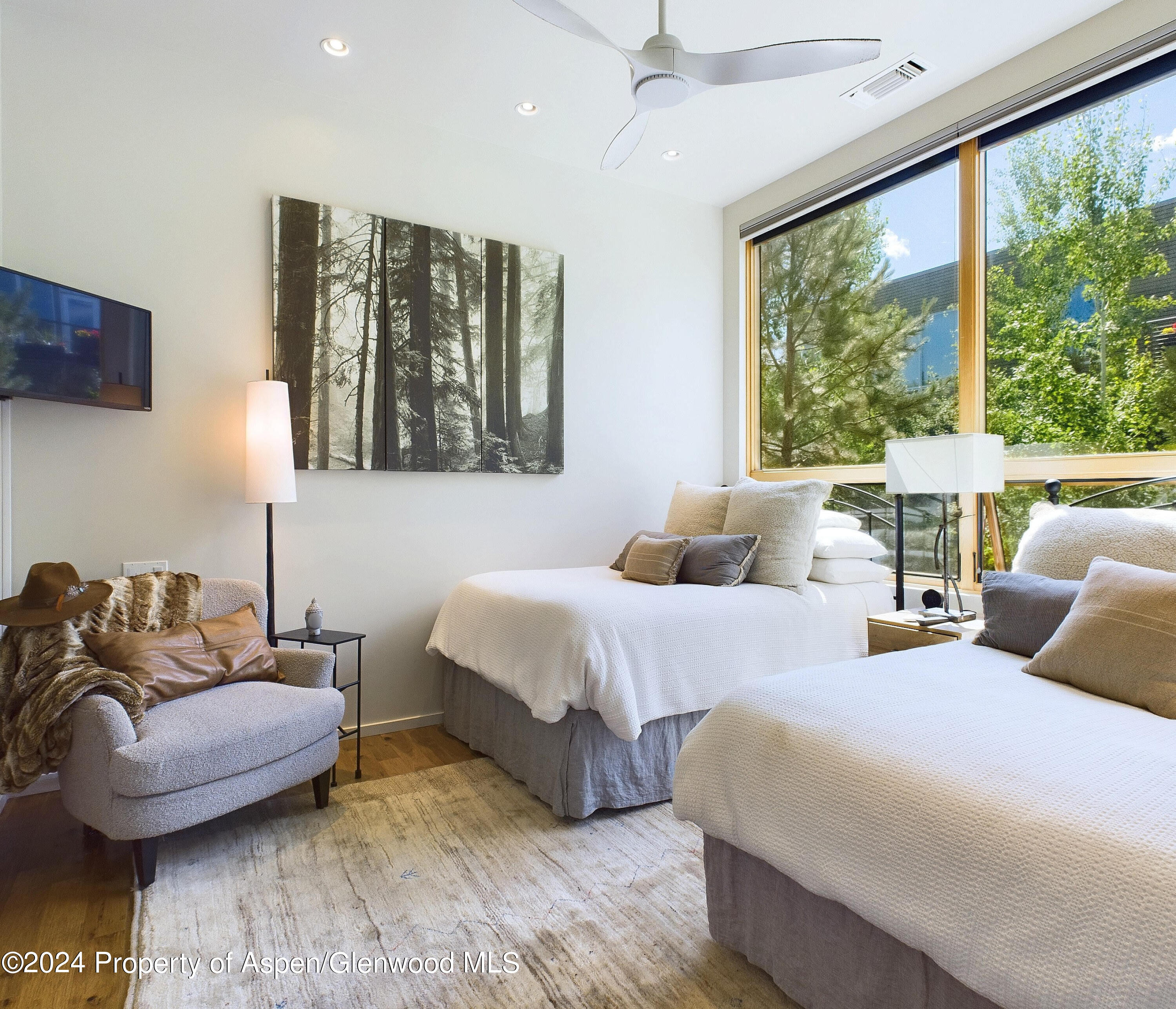 100 Evans Road, Unit 105 Basalt, CO 81621 - Photo 10 of 20 a bedroom with two beds and a large window