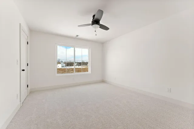 a bathroom with a toilet and a bathtub