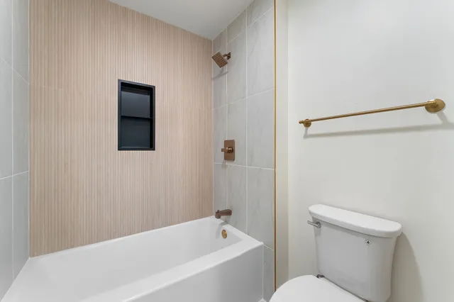 a view of a balcony with wooden floor