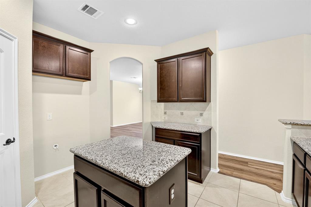 217 Rugby Lane McKinney, TX 75072 - Photo 16 of 40 a bathroom with a sink and a mirror