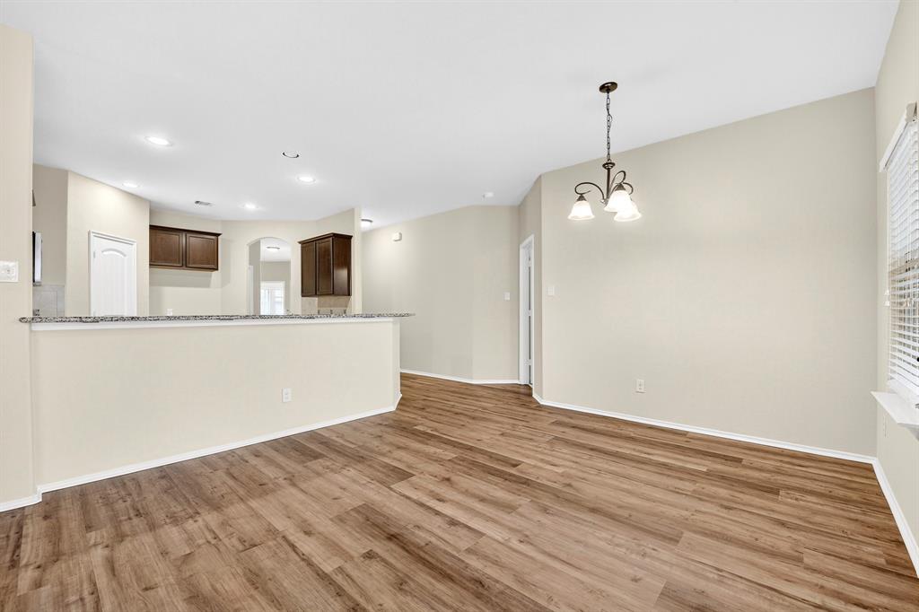 217 Rugby Lane McKinney, TX 75072 - Photo 22 of 40 a view of a kitchen with a sink and a dishwasher