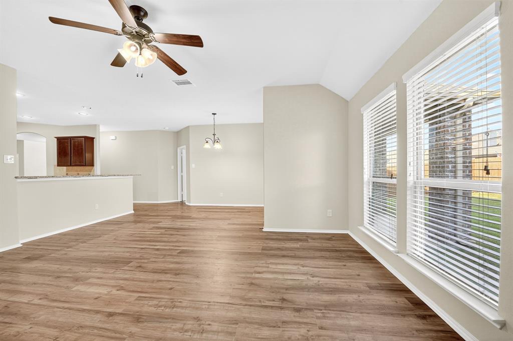 217 Rugby Lane McKinney, TX 75072 - Photo 26 of 40 a view of empty room with wooden floor and fan