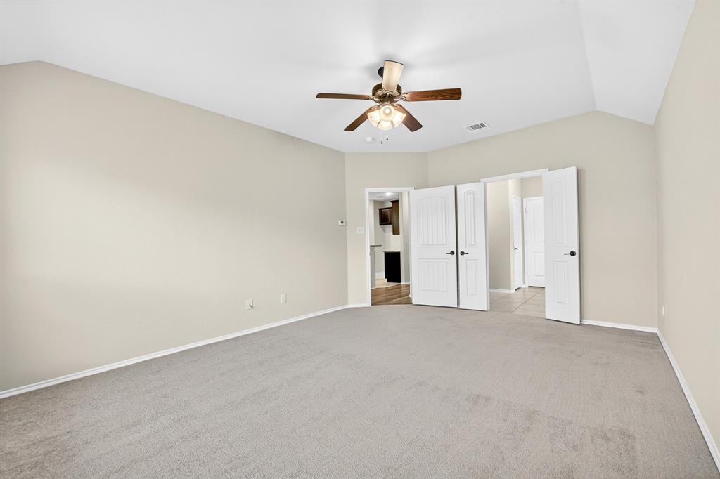 217 Rugby Lane McKinney, TX 75072 - Photo 30 of 40 an empty room with closet and windows