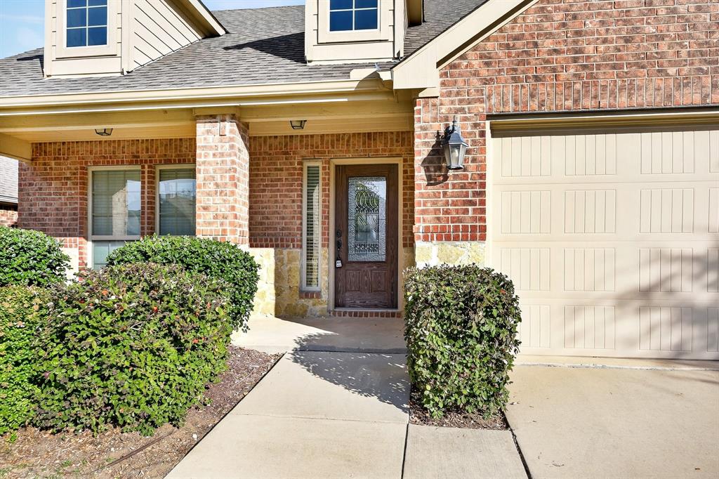 217 Rugby Lane McKinney, TX 75072 - Photo 3 of 40 a view of a entryway door front of house