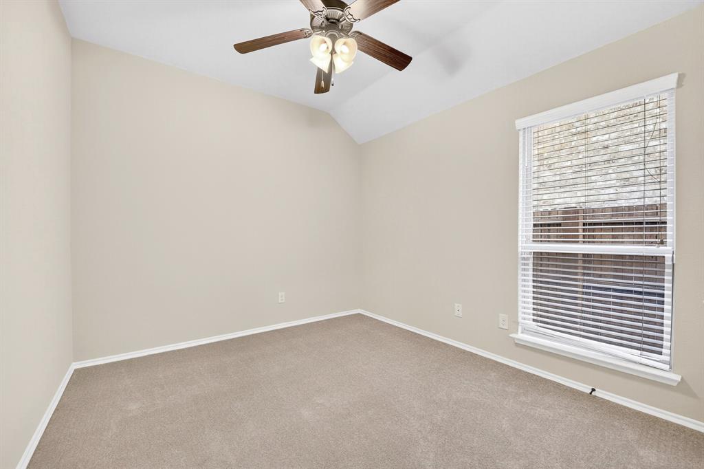 217 Rugby Lane McKinney, TX 75072 - Photo 36 of 40 an empty room with a window and a fan