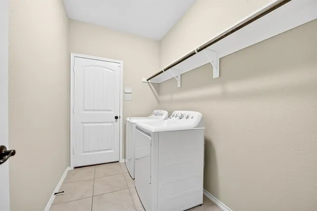 a utility room with cabinets