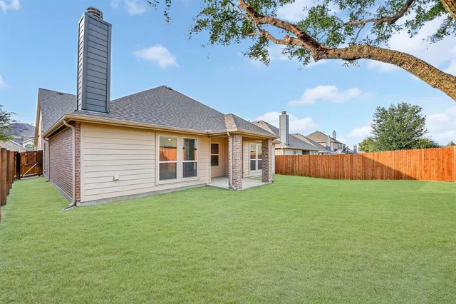 a backyard of a house with lots of green space