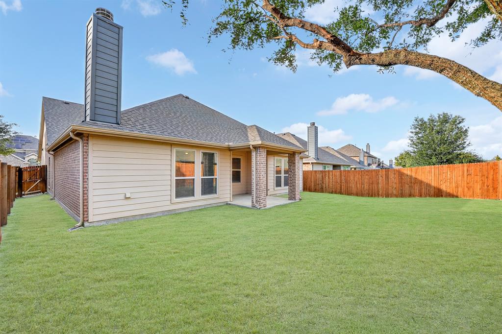 217 Rugby Lane McKinney, TX 75072 - Photo 40 of 40 a backyard of a house with lots of green space