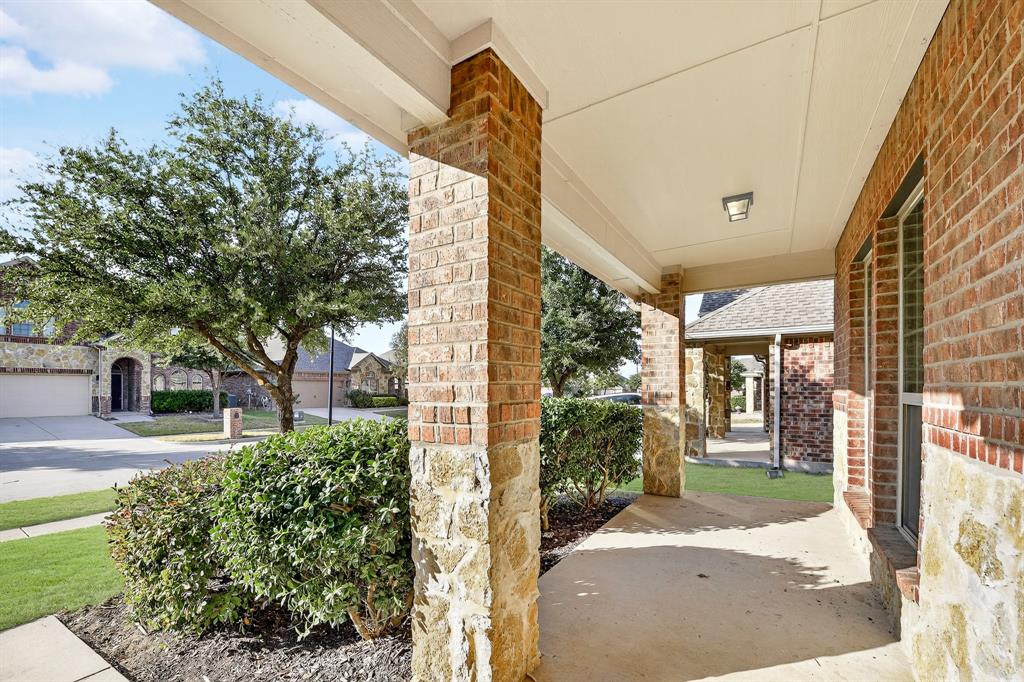 217 Rugby Lane McKinney, TX 75072 - Photo 4 of 40 a view of a house with a yard