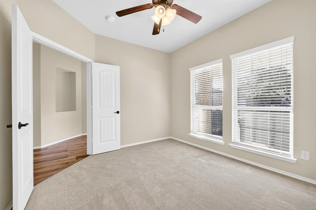 217 Rugby Lane McKinney, TX 75072 - Photo 9 of 40 a view of an empty room with a window