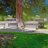 a view of a house with a yard and sitting area