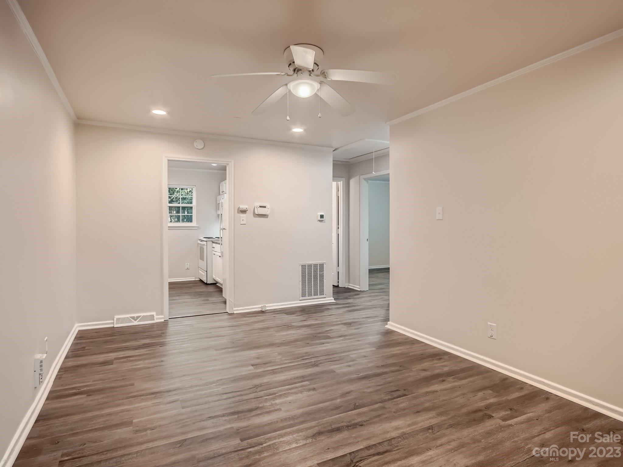 3219 Minnesota Road Charlotte, NC 28208 - Photo 3 of 11 a view of an empty room with wooden floor