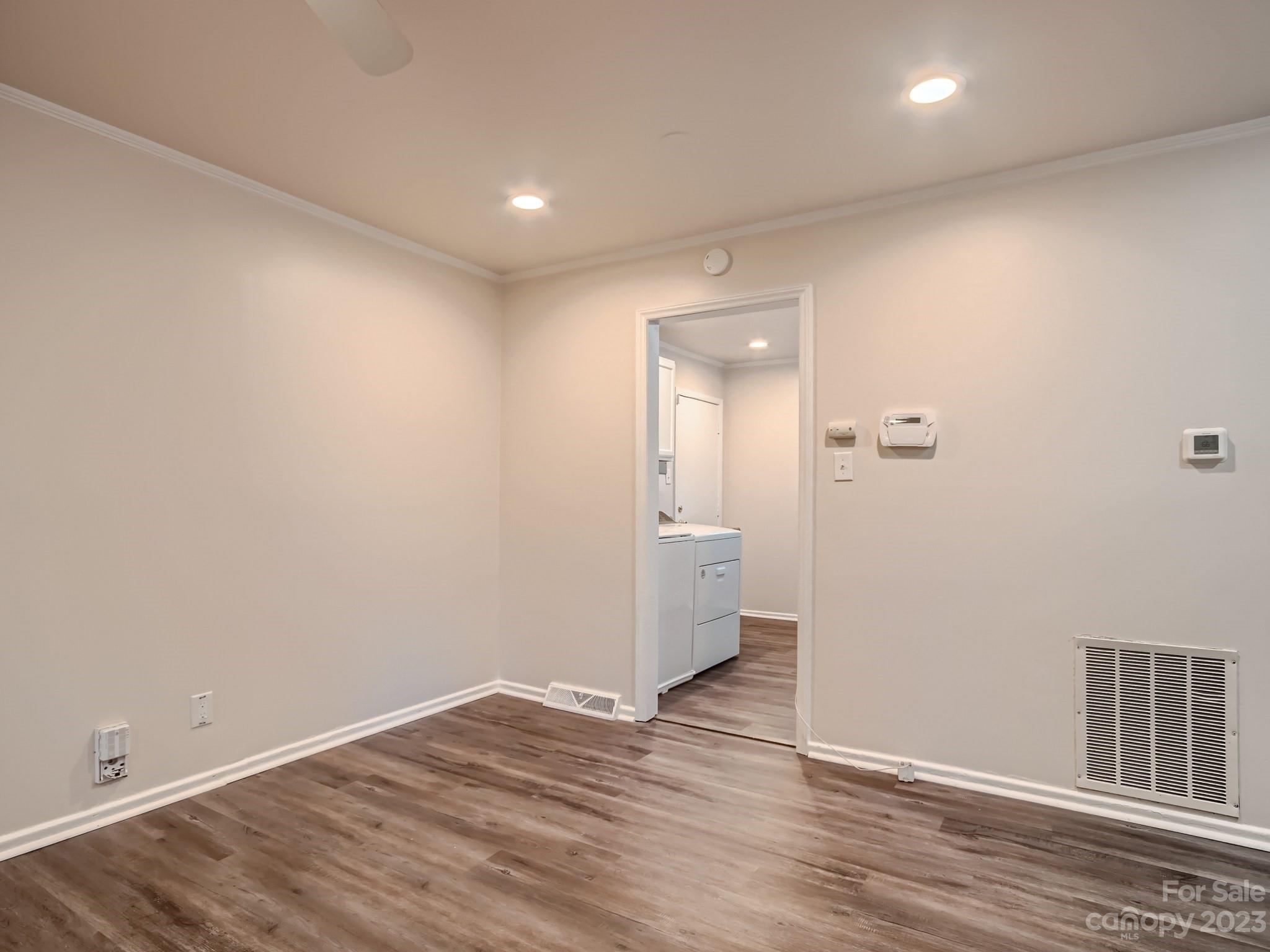 3219 Minnesota Road Charlotte, NC 28208 - Photo 10 of 11 a view of a room with wooden floor and a bathroom