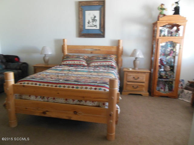 22 Virrey Court Rio Rico, AZ 85648 - Photo 12 of 14 a bedroom with a bed and a lamp