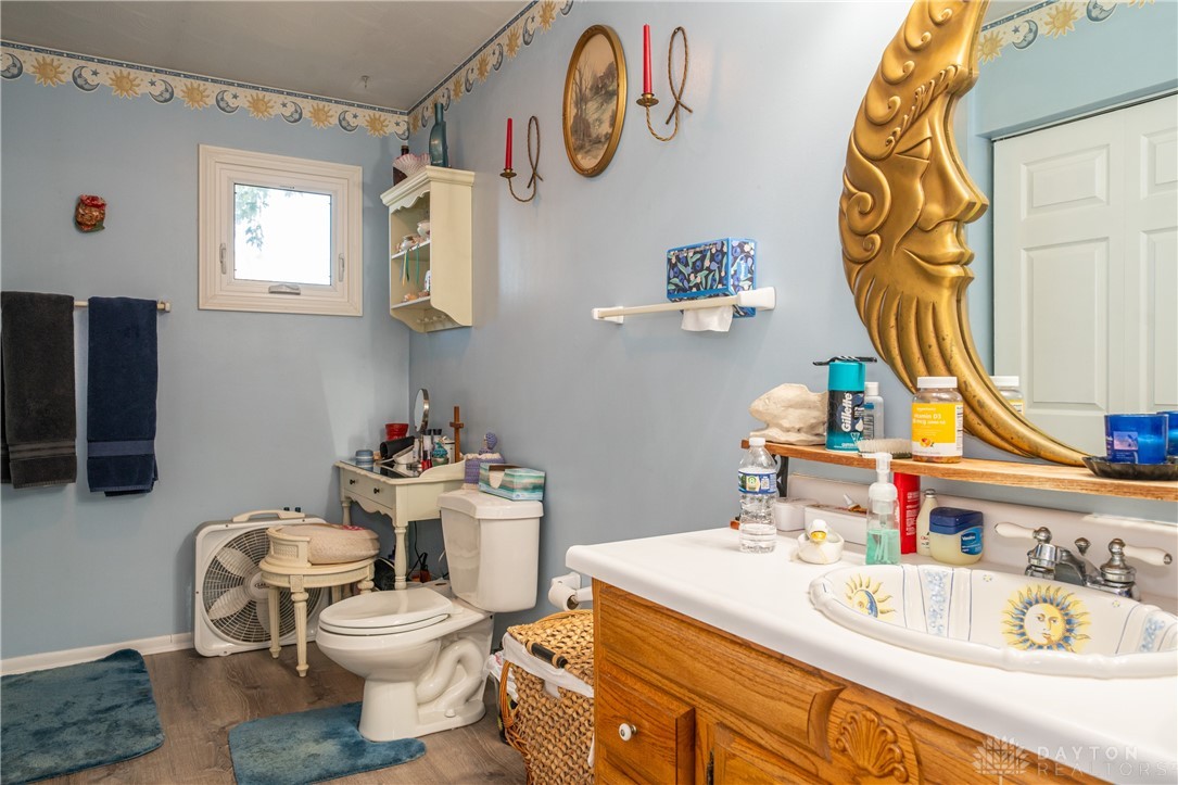 1599 Garringer Road Jamestown, OH 45335 - Photo 17 of 73 This bathroom features durable flooring and a window, creating a refreshing atmosphere.