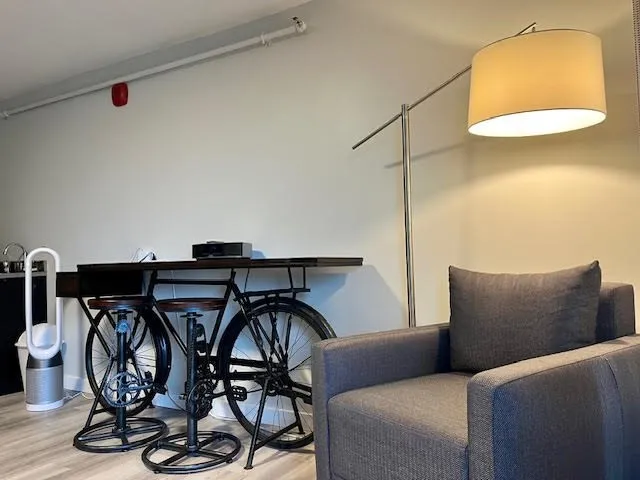 a blue kitchen with a table and chairs