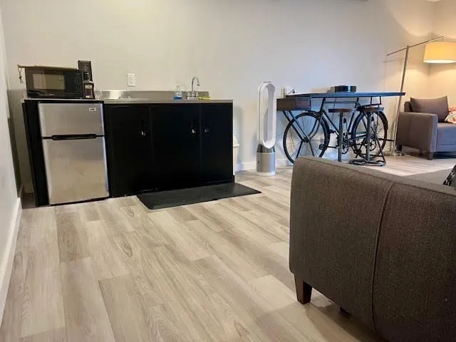 a kitchen with a refrigerator and a sink