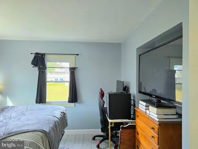 a bedroom with a workspace