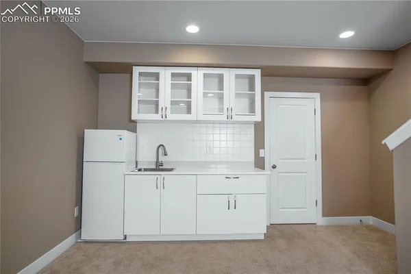 a view of cabinets with wooden floor
