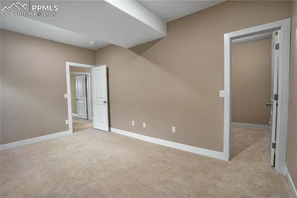 an empty room with closet area