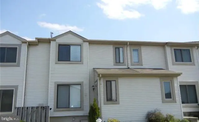 a front view of a house with yard
