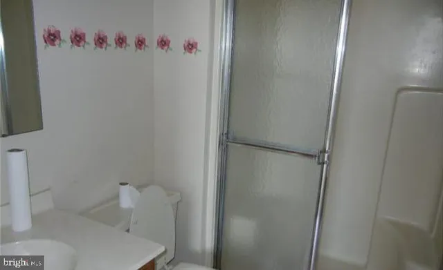 a bathroom with a bathtub and a toilet