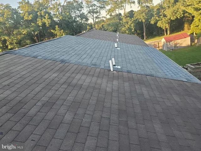 a view of a backyard of the house