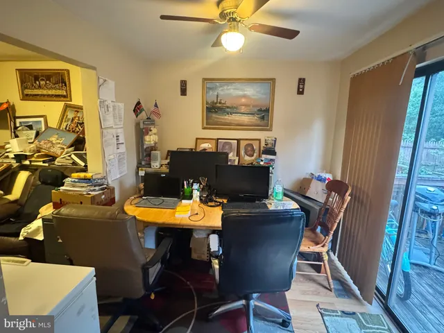 a view of a dining room with furniture and a window