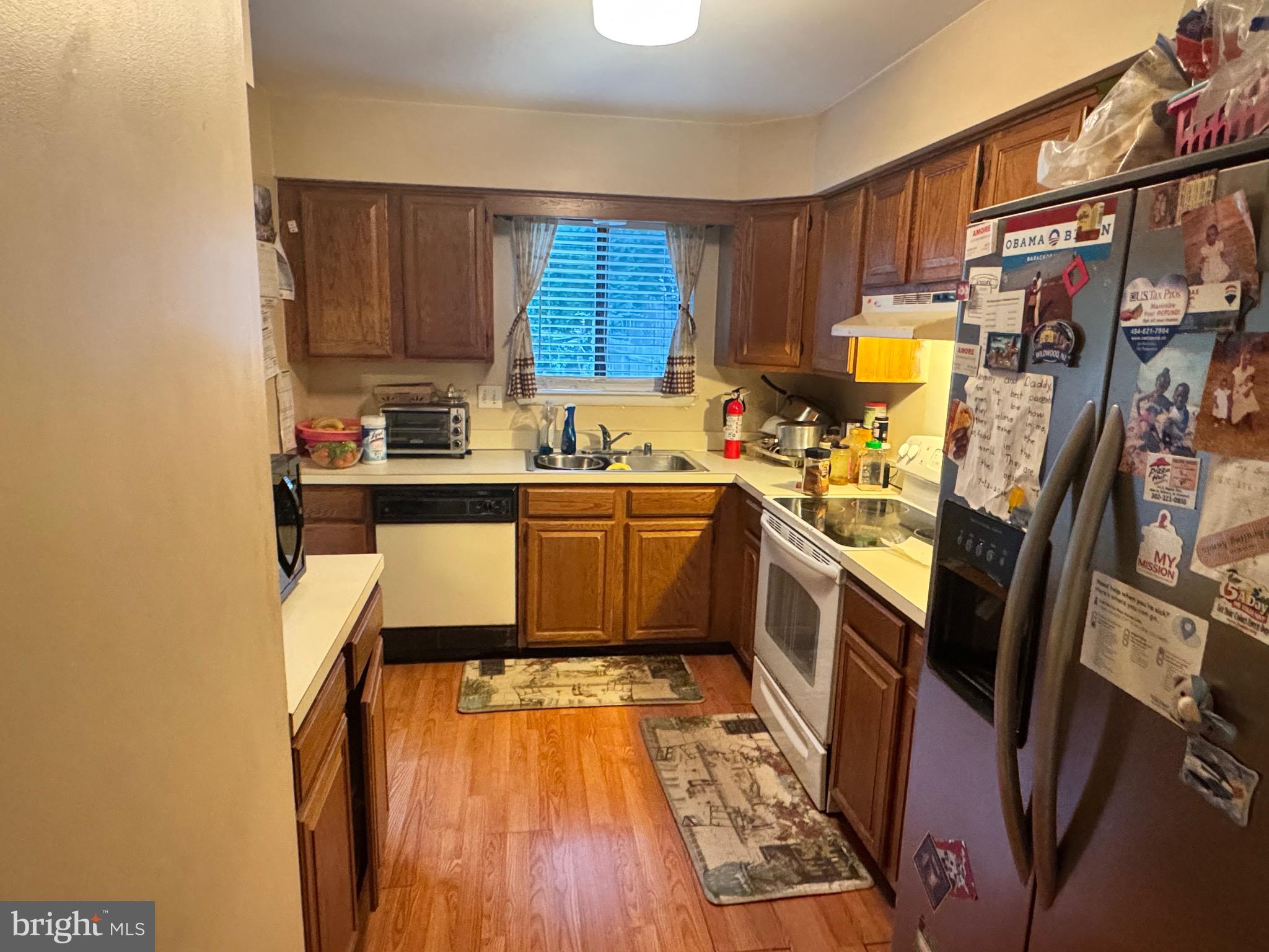 5 Liborio Lane New Castle, DE 19720 - Photo 8 of 18 a kitchen with stainless steel appliances a sink stove and cabinets