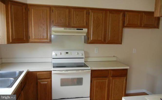 5 Liborio Lane New Castle, DE 19720 - Photo 9 of 18 a stove top oven sitting inside of a kitchen