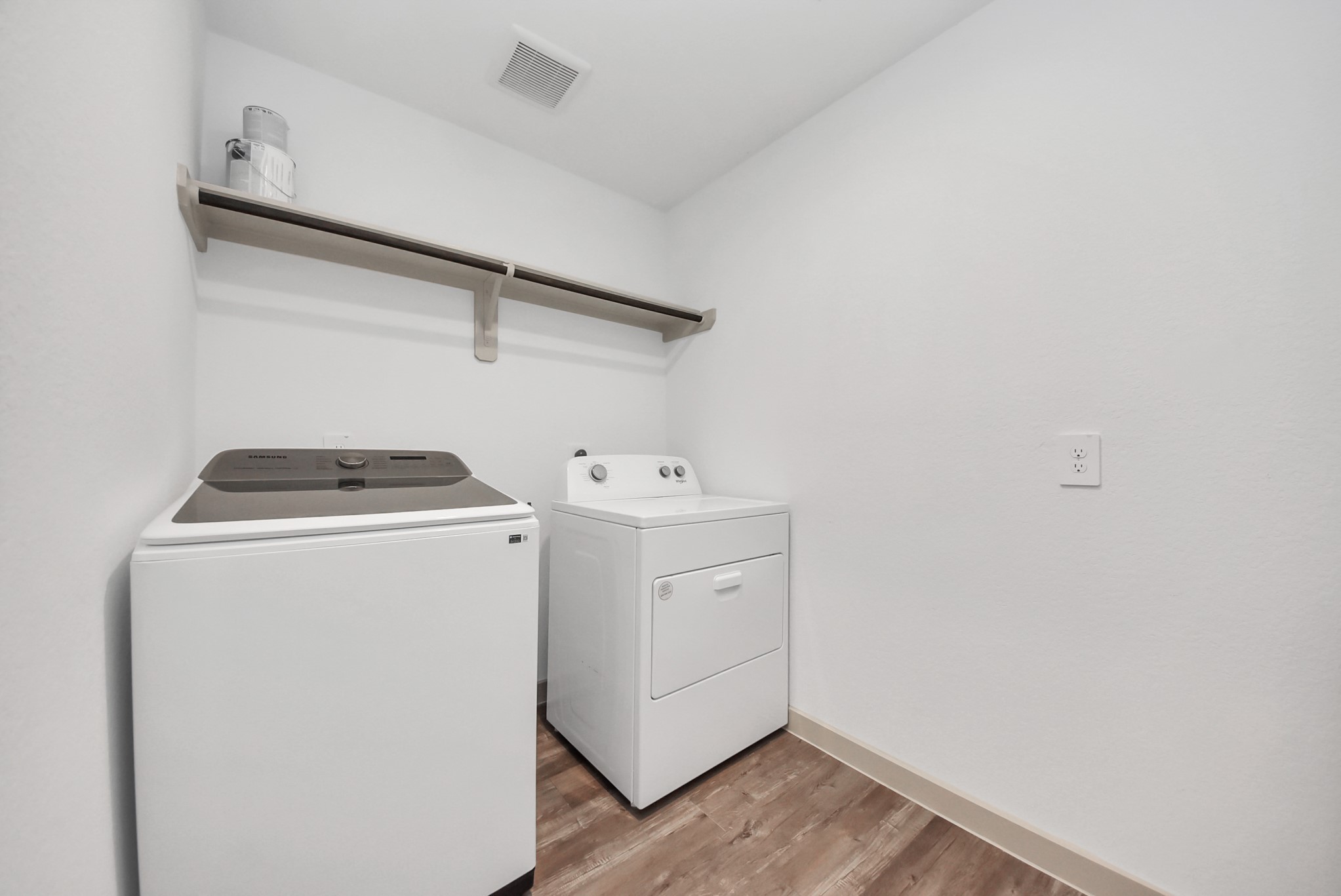 7911 Wrangler Shack Lane Rosharon, TX 77583 - Photo 21 of 40 Spacious laundry room featuring a modern washer and dryer, with a convenient overhead shelf for storage.
