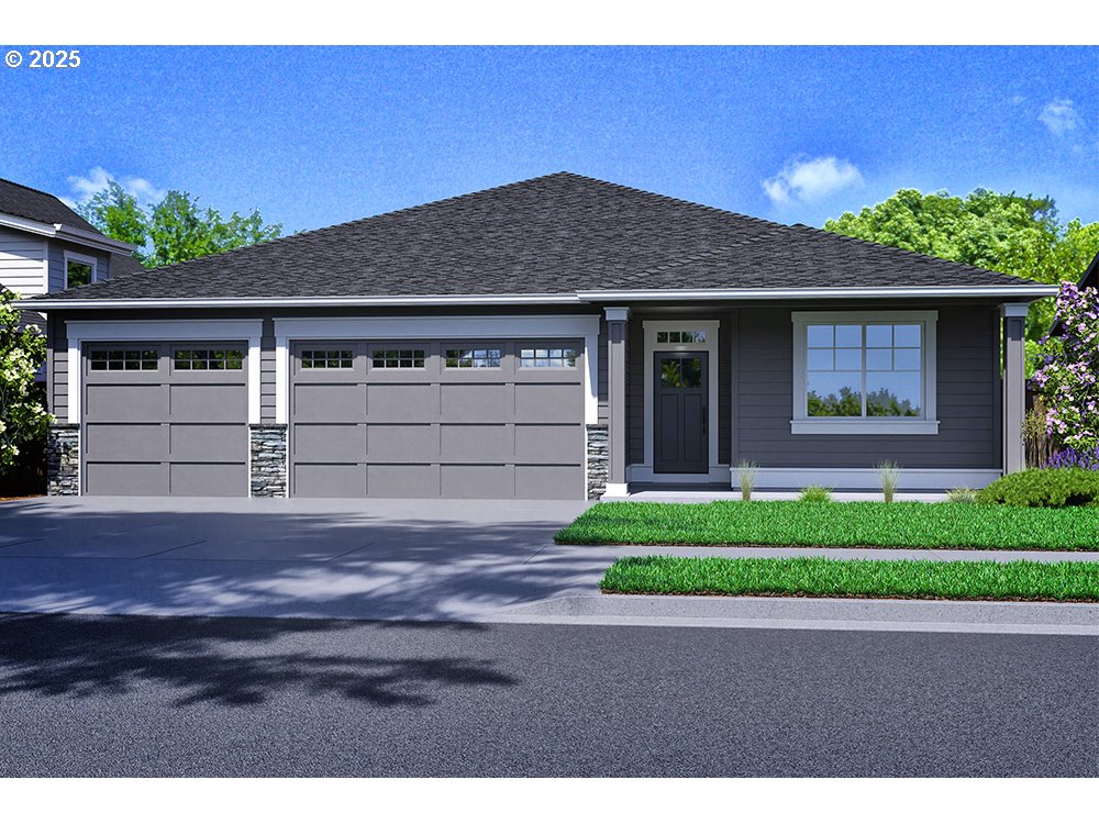 a front view of a house with a yard and a garage
