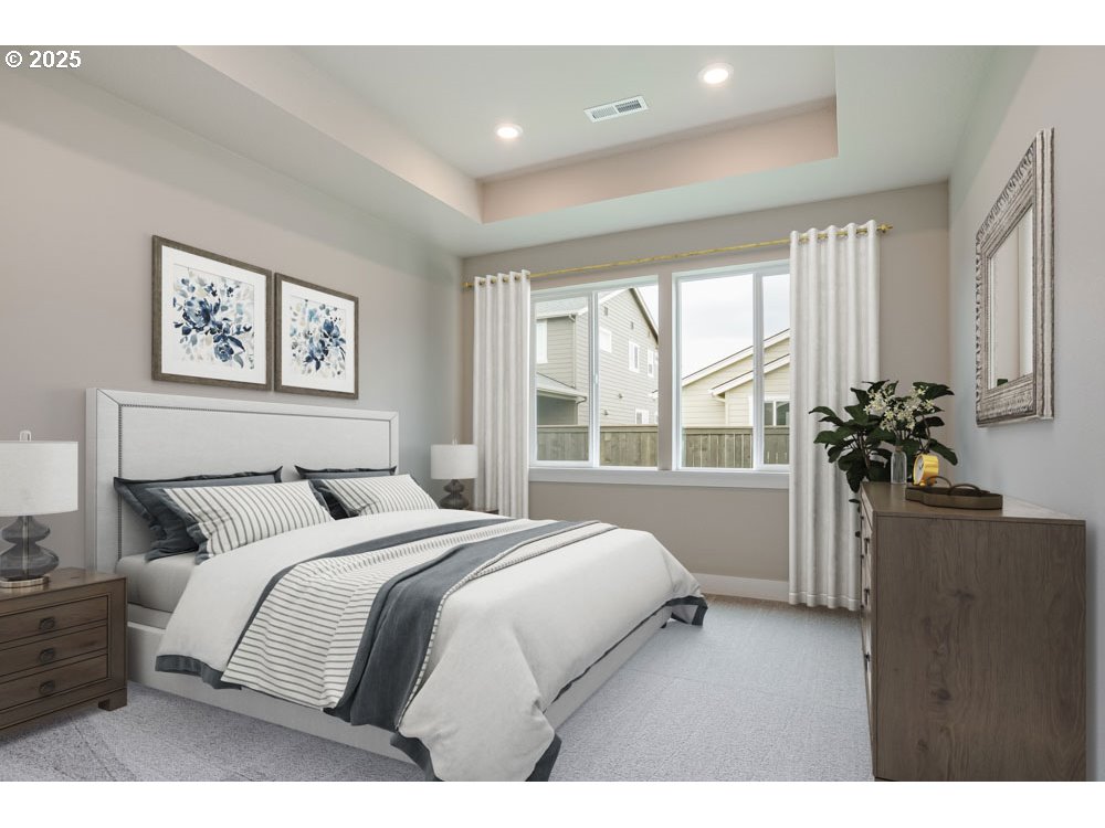 4531 South 39th Drive Ridgefield, WA 98642 - Photo 5 of 8 a bedroom with a large bed and a potted plant