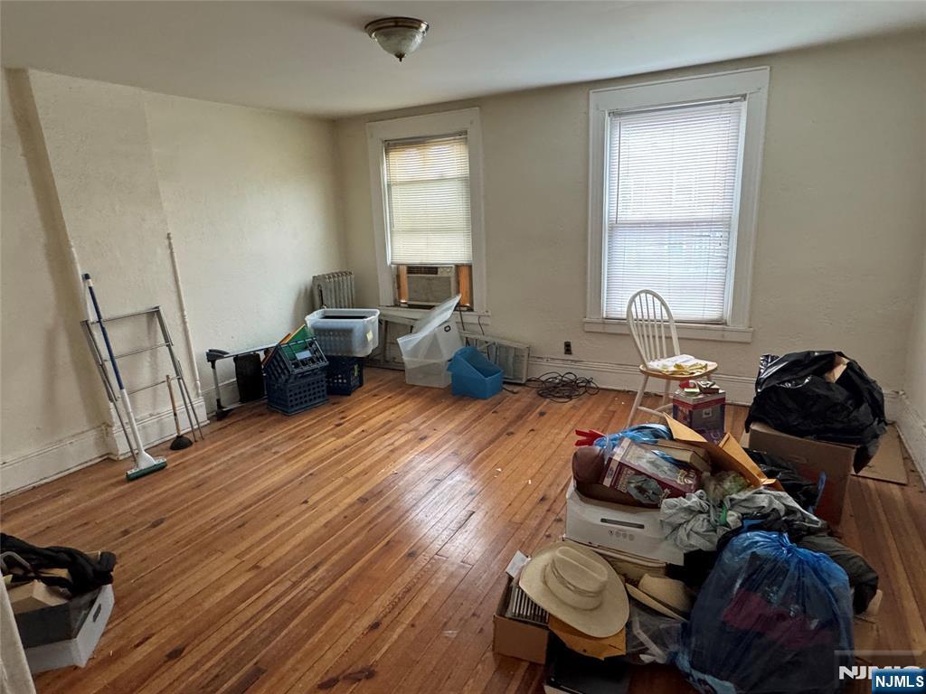 680 1/2 Chestnut Street Kearny, NJ 07032 - Photo 3 of 6 a living room with furniture and a wooden floor