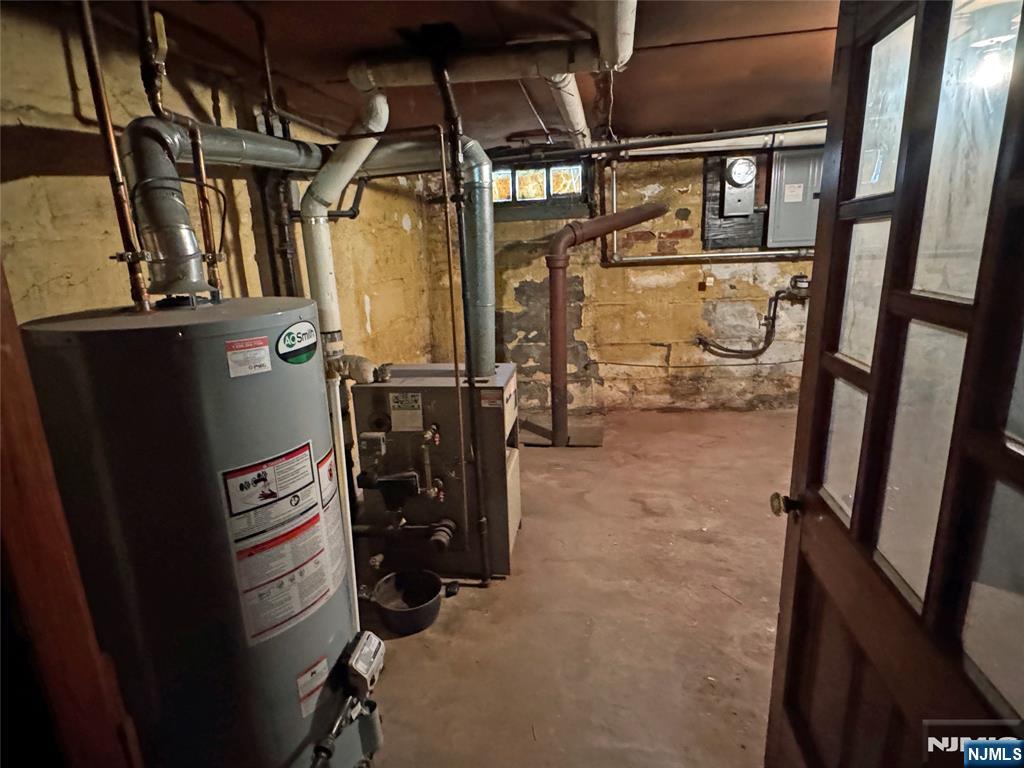 680 1/2 Chestnut Street Kearny, NJ 07032 - Photo 4 of 6 a view of walk in closet with clothes and shoes