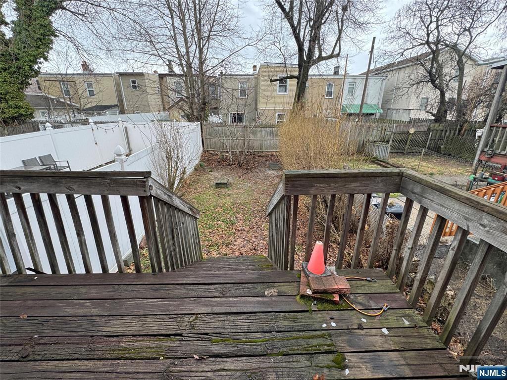680 1/2 Chestnut Street Kearny, NJ 07032 - Photo 5 of 6 a view of wooden balcony with wooden floor and fence
