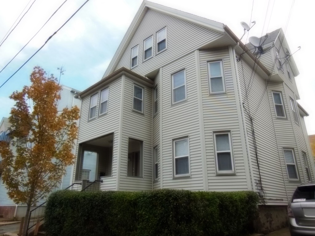 29 Chatham Road Everett, MA 02149 - Photo 1 of 14 a front view of a house with a yard