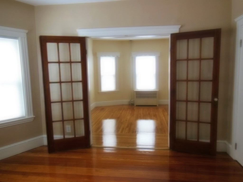 29 Chatham Road Everett, MA 02149 - Photo 11 of 14 a view of empty room with wooden floor and fan