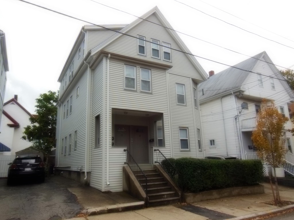 29 Chatham Road Everett, MA 02149 - Photo 2 of 14 a front view of a house with garage