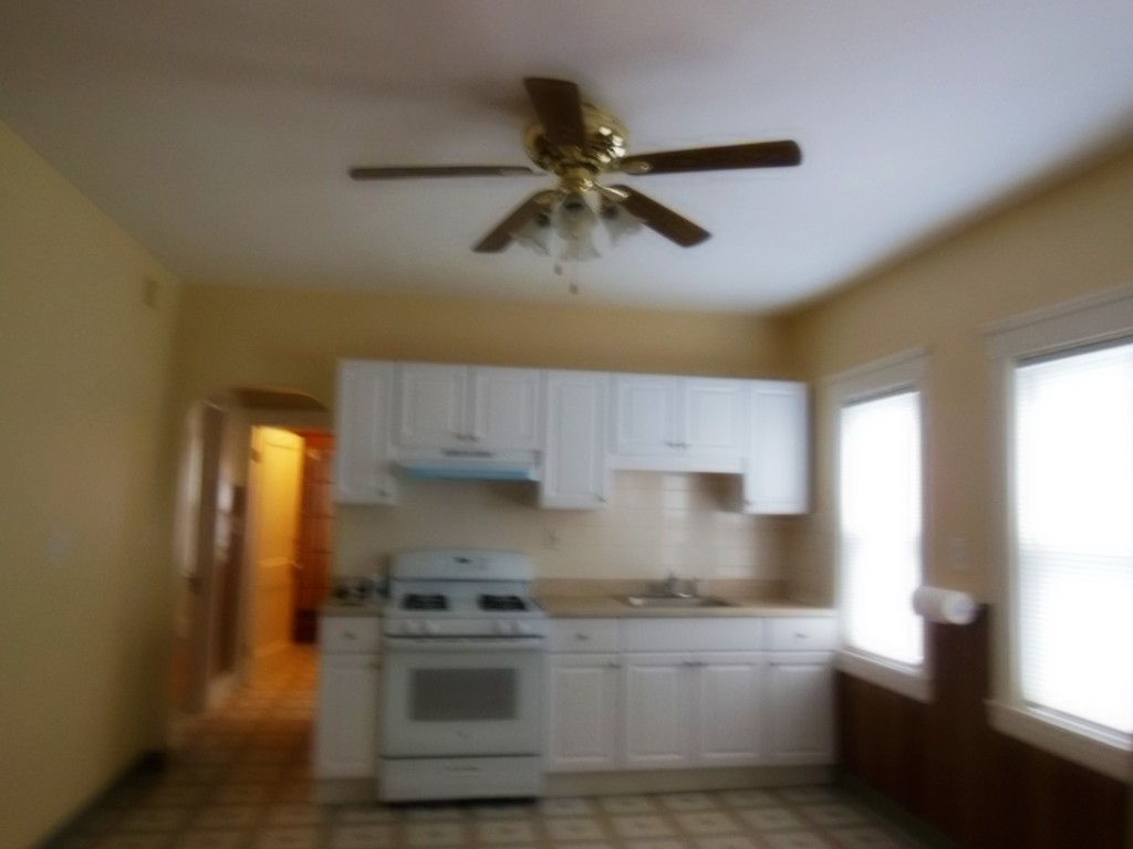 29 Chatham Road Everett, MA 02149 - Photo 3 of 14 a kitchen with stainless steel appliances granite countertop a sink a stove and a refrigerator