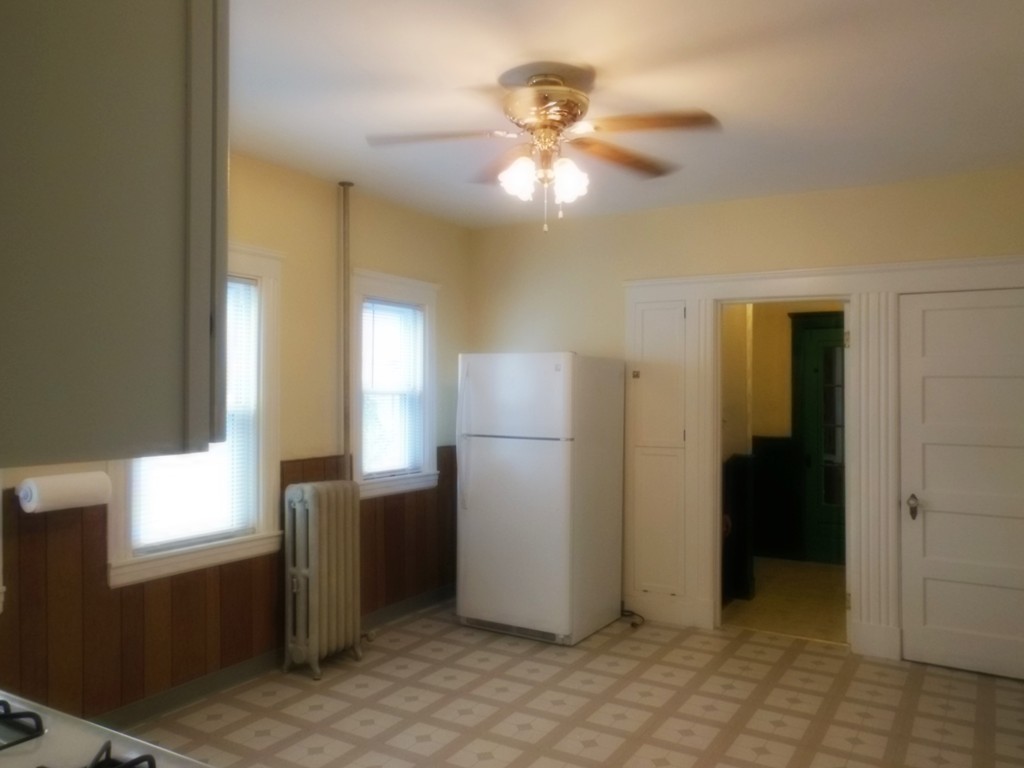 29 Chatham Road Everett, MA 02149 - Photo 5 of 14 a view of a kitchen with a refrigerator cabinets and a window