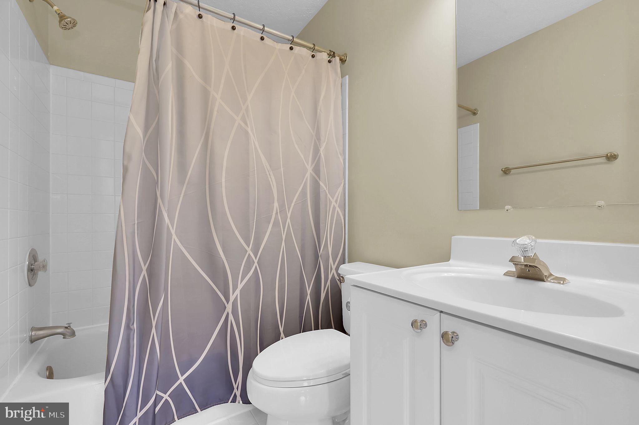 7150 Natures Road Columbia, MD 21046 - Photo 18 of 45 a bathroom with a sink a toilet and shower
